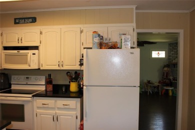 Welcome home to 1314 E Todd Street, in a prime location right on Pine Hills Country Club in Louisiana - for sale on GolfHomes.com, golf home, golf lot