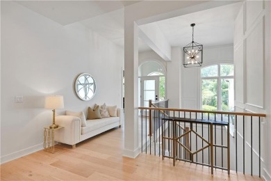 This gorgeous complete remodel by Evan Talan homes shows like a on Loch Lloyd Country Club in Missouri - for sale on GolfHomes.com, golf home, golf lot