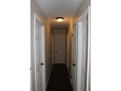 Welcome home to 1314 E Todd Street, in a prime location right on Pine Hills Country Club in Louisiana - for sale on GolfHomes.com, golf home, golf lot