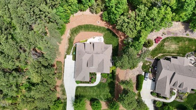 Welcome to an exceptional custom home nestled on nearly an acre on Chapel Ridge Golf Club in North Carolina - for sale on GolfHomes.com, golf home, golf lot