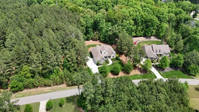 Welcome to an exceptional custom home nestled on nearly an acre on Chapel Ridge Golf Club in North Carolina - for sale on GolfHomes.com, golf home, golf lot