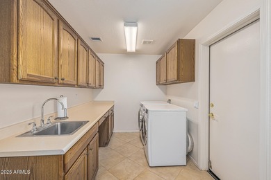 This immaculate, well-maintained home is nestled in a quiet on Tuscany Falls At Pebble Creek in Arizona - for sale on GolfHomes.com, golf home, golf lot