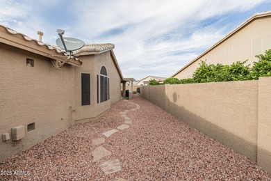 This immaculate, well-maintained home is nestled in a quiet on Tuscany Falls At Pebble Creek in Arizona - for sale on GolfHomes.com, golf home, golf lot