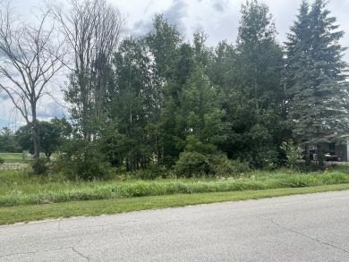 This vacant lot is an excellent opportunity to build your dream on Sugar Springs Country Club in Michigan - for sale on GolfHomes.com, golf home, golf lot