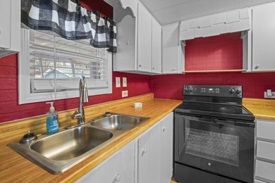 Tucked inside the charming Ocean Pines 55+ community in Murrells on Indigo Creek Golf Club in South Carolina - for sale on GolfHomes.com, golf home, golf lot