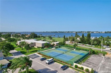 Gorgeous UPDATED Kitchen and Baths. Impact windows and tile on Martin County Golf Course in Florida - for sale on GolfHomes.com, golf home, golf lot