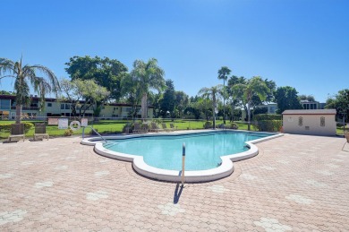 Nestled in Abbey Village, Delray Beach, this beautifully fully on Marina Lakes Golf Course in Florida - for sale on GolfHomes.com, golf home, golf lot