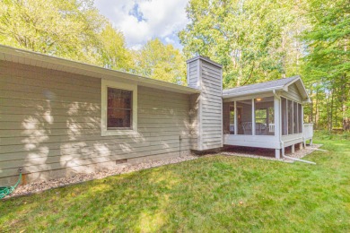 Nestled in a quiet and secluded area of Canadian Lakes, this on Canadian Lakes Country Club-The Royal Course in Michigan - for sale on GolfHomes.com, golf home, golf lot