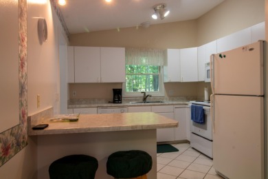 Nestled in a quiet and secluded area of Canadian Lakes, this on Canadian Lakes Country Club-The Royal Course in Michigan - for sale on GolfHomes.com, golf home, golf lot