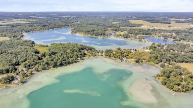 LUXURIOUS LAKEFRONT HOME ON MICHIGAN'S CRYSTAL CLEAR  CARRIBEAN on Deer Run Golf Club in Michigan - for sale on GolfHomes.com, golf home, golf lot