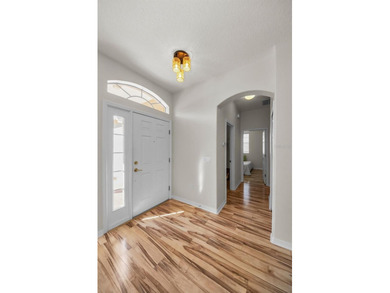 From the elegant front portico and pristine landscaping to the on Heritage Pines Country Club in Florida - for sale on GolfHomes.com, golf home, golf lot