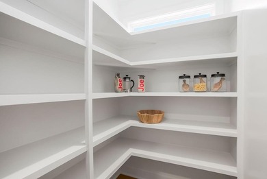 This new reverse 1.5-story Somerset plan by Elevate Design + on Heritage Park Golf Course in Kansas - for sale on GolfHomes.com, golf home, golf lot