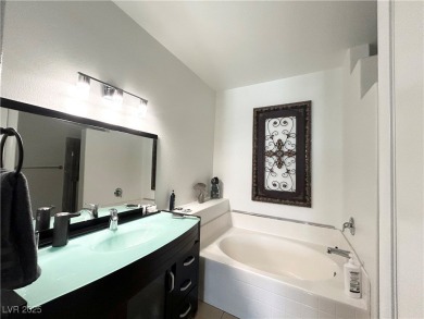 Stylish 2-Bed, 2-Bath Condo in a Gated Community Next to Desert on Desert Rose Golf Course in Nevada - for sale on GolfHomes.com, golf home, golf lot