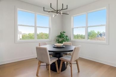 This new reverse 1.5-story Somerset plan by Elevate Design + on Heritage Park Golf Course in Kansas - for sale on GolfHomes.com, golf home, golf lot