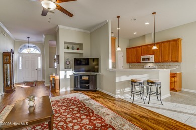 Golf-front living, sunset views, and coastal convenience-this on Meadowlands Golf Club in North Carolina - for sale on GolfHomes.com, golf home, golf lot