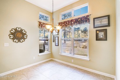 Golf-front living, sunset views, and coastal convenience-this on Meadowlands Golf Club in North Carolina - for sale on GolfHomes.com, golf home, golf lot