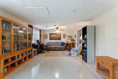 Nestled on a spacious half-acre lot in the desirable Indian Lake on Indian Lake Estates Golf and Country Club in Florida - for sale on GolfHomes.com, golf home, golf lot