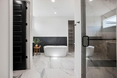 This new reverse 1.5-story Somerset plan by Elevate Design + on Heritage Park Golf Course in Kansas - for sale on GolfHomes.com, golf home, golf lot