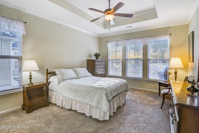 Golf-front living, sunset views, and coastal convenience-this on Meadowlands Golf Club in North Carolina - for sale on GolfHomes.com, golf home, golf lot