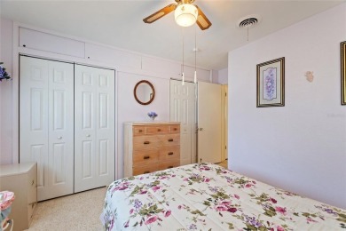 Nestled on a spacious half-acre lot in the desirable Indian Lake on Indian Lake Estates Golf and Country Club in Florida - for sale on GolfHomes.com, golf home, golf lot