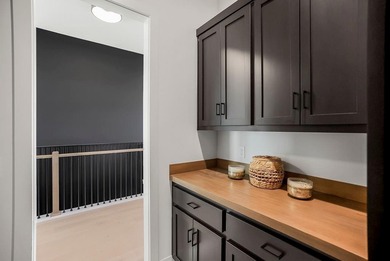 This new reverse 1.5-story Somerset plan by Elevate Design + on Heritage Park Golf Course in Kansas - for sale on GolfHomes.com, golf home, golf lot