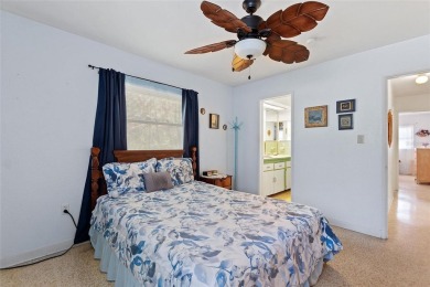 Nestled on a spacious half-acre lot in the desirable Indian Lake on Indian Lake Estates Golf and Country Club in Florida - for sale on GolfHomes.com, golf home, golf lot