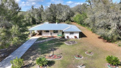 Nestled on a spacious half-acre lot in the desirable Indian Lake on Indian Lake Estates Golf and Country Club in Florida - for sale on GolfHomes.com, golf home, golf lot