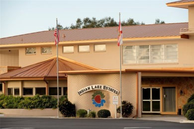 Nestled on a spacious half-acre lot in the desirable Indian Lake on Indian Lake Estates Golf and Country Club in Florida - for sale on GolfHomes.com, golf home, golf lot