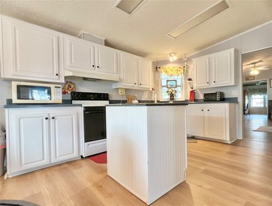 The only 3-Bedroom Home active on the market for sale in Palm on Palm Hill Golf Club in Florida - for sale on GolfHomes.com, golf home, golf lot