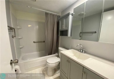 Welcome to this beautifully updated 2-bedroom, 2-bathroom condo on Wynmoor Golf Course in Florida - for sale on GolfHomes.com, golf home, golf lot