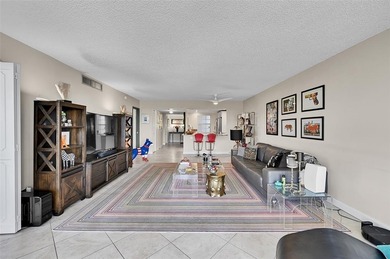 This fully remodeled unit features an open kitchen with white on Palm-Aire Country Club and Resort - Palms in Florida - for sale on GolfHomes.com, golf home, golf lot