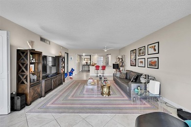 This fully remodeled unit features an open kitchen with white on Palm-Aire Country Club and Resort - Palms in Florida - for sale on GolfHomes.com, golf home, golf lot
