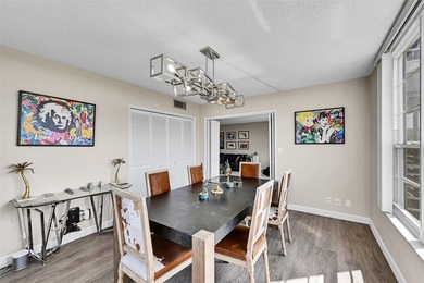 This fully remodeled unit features an open kitchen with white on Palm-Aire Country Club and Resort - Palms in Florida - for sale on GolfHomes.com, golf home, golf lot