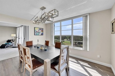 This fully remodeled unit features an open kitchen with white on Palm-Aire Country Club and Resort - Palms in Florida - for sale on GolfHomes.com, golf home, golf lot