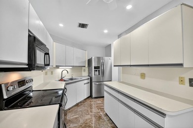 Beautifully maintained 3-bed, 2.5-bath villa with golf course on Fountains Golf and Country Club in Florida - for sale on GolfHomes.com, golf home, golf lot