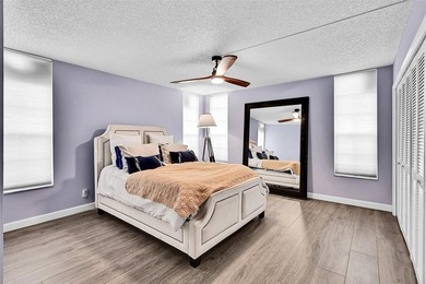 This fully remodeled unit features an open kitchen with white on Palm-Aire Country Club and Resort - Palms in Florida - for sale on GolfHomes.com, golf home, golf lot