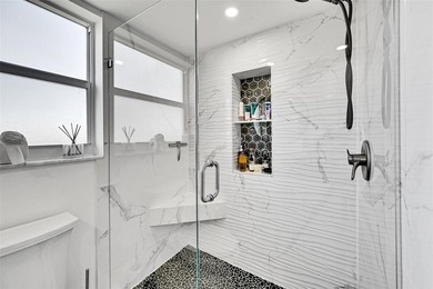 This fully remodeled unit features an open kitchen with white on Palm-Aire Country Club and Resort - Palms in Florida - for sale on GolfHomes.com, golf home, golf lot