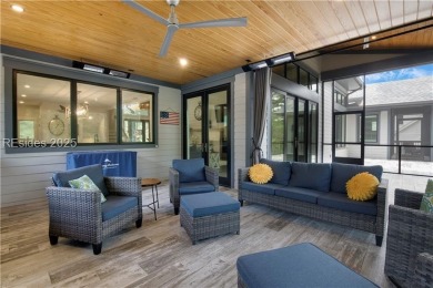 Enjoying views across a lake toward Moss Creek South's 8 th Hole on Moss Creek Golf Club in South Carolina - for sale on GolfHomes.com, golf home, golf lot