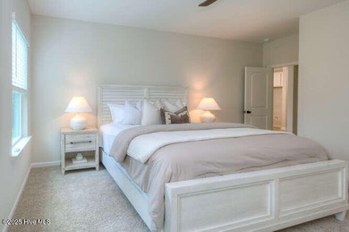 Welcome to this beautifully appointed 4-bedroom, 3-bath home on Carolina National Golf Club in North Carolina - for sale on GolfHomes.com, golf home, golf lot