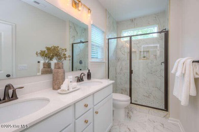 Welcome to this beautifully appointed 4-bedroom, 3-bath home on Carolina National Golf Club in North Carolina - for sale on GolfHomes.com, golf home, golf lot