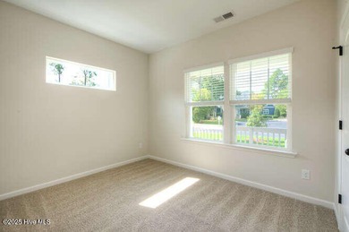 Welcome to this beautifully appointed 4-bedroom, 3-bath home on Carolina National Golf Club in North Carolina - for sale on GolfHomes.com, golf home, golf lot