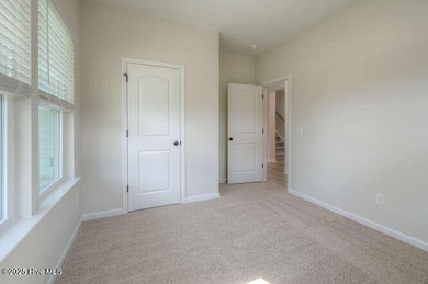 Welcome to this beautifully appointed 4-bedroom, 3-bath home on Carolina National Golf Club in North Carolina - for sale on GolfHomes.com, golf home, golf lot