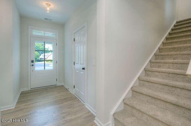 Welcome to this beautifully appointed 4-bedroom, 3-bath home on Carolina National Golf Club in North Carolina - for sale on GolfHomes.com, golf home, golf lot