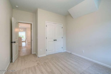 Welcome to this beautifully appointed 4-bedroom, 3-bath home on Carolina National Golf Club in North Carolina - for sale on GolfHomes.com, golf home, golf lot