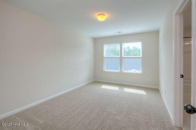 Welcome to this beautifully appointed 4-bedroom, 3-bath home on Carolina National Golf Club in North Carolina - for sale on GolfHomes.com, golf home, golf lot