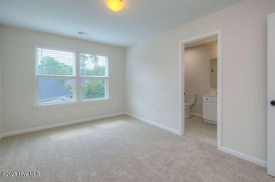 Welcome to this beautifully appointed 4-bedroom, 3-bath home on Carolina National Golf Club in North Carolina - for sale on GolfHomes.com, golf home, golf lot