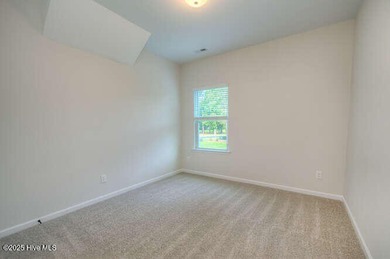 Welcome to this beautifully appointed 4-bedroom, 3-bath home on Carolina National Golf Club in North Carolina - for sale on GolfHomes.com, golf home, golf lot