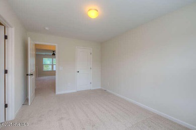 Welcome to this beautifully appointed 4-bedroom, 3-bath home on Carolina National Golf Club in North Carolina - for sale on GolfHomes.com, golf home, golf lot