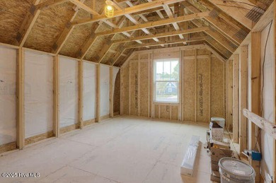 Welcome to this beautifully appointed 4-bedroom, 3-bath home on Carolina National Golf Club in North Carolina - for sale on GolfHomes.com, golf home, golf lot