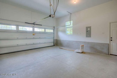 Welcome to this beautifully appointed 4-bedroom, 3-bath home on Carolina National Golf Club in North Carolina - for sale on GolfHomes.com, golf home, golf lot